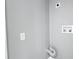 Bright laundry room featuring modern light gray walls and utility hookups at 3755 10Th S Ave, St Petersburg, FL 33711