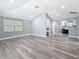 Bright, airy living room with vaulted ceilings and new vinyl flooring, showcasing open concept design at 3755 10Th S Ave, St Petersburg, FL 33711