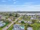 Aerial view showcasing neighborhood with city skyline in distance, and waterfront access at 3801 Alabama Ne Ave, St Petersburg, FL 33703