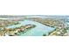 An aerial view showcases waterfront homes and bridge access in a desirable community, perfect for boating at 3820 Gulf Blvd # 802, St Pete Beach, FL 33706