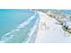 Stunning aerial view of a pristine beach, showcasing the turquoise water and white sand at 3820 Gulf Blvd # 802, St Pete Beach, FL 33706
