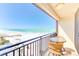 Relaxing balcony featuring seating and panoramic ocean views of the beach at 3820 Gulf Blvd # 802, St Pete Beach, FL 33706