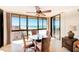 Bright dining area with a glass table, wicker chairs, and spectacular ocean views at 3820 Gulf Blvd # 802, St Pete Beach, FL 33706