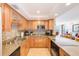 Well-lit kitchen featuring a breakfast bar with seating and stainless appliances at 3820 Gulf Blvd # 802, St Pete Beach, FL 33706