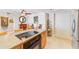 Bright kitchen island includes range, cabinets, and access to an open living area at 3820 Gulf Blvd # 802, St Pete Beach, FL 33706