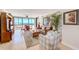 Bright living room with tile flooring, comfortable seating, and beautiful ocean views at 3820 Gulf Blvd # 802, St Pete Beach, FL 33706