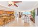 Open-concept living space with breakfast bar, ocean view, and stylish furnishings at 3820 Gulf Blvd # 802, St Pete Beach, FL 33706