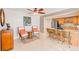 Charming living room and kitchen area with tiled floors and natural lighting at 3820 Gulf Blvd # 802, St Pete Beach, FL 33706