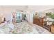 Bedroom with mirrored closet doors, dresser, and a floral-patterned bedspread at 3820 Gulf Blvd # 802, St Pete Beach, FL 33706