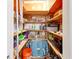 Walk-in pantry has wooden shelves for storage at 3820 Gulf Blvd # 802, St Pete Beach, FL 33706