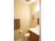 Cozy half bathroom featuring tiled floors, neutral paint, and a comfortable vanity at 408 Gloucester Blvd # 33, Sun City Center, FL 33573