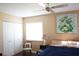 Cozy bedroom featuring a ceiling fan, closet and natural light from the window at 408 Gloucester Blvd # 33, Sun City Center, FL 33573