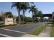 Kings Point community entrance featuring manicured landscaping, stately signage, and a welcoming archway at 408 Gloucester Blvd # 33, Sun City Center, FL 33573