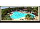 Active community pool scene with residents enjoying a refreshing swim in a large outdoor pool at 408 Gloucester Blvd # 33, Sun City Center, FL 33573