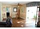 Open-concept dining area with hardwood floors and access to the living room and kitchen at 408 Gloucester Blvd # 33, Sun City Center, FL 33573