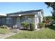 Charming single story home with a well-manicured lawn and inviting front entrance at 408 Gloucester Blvd # 33, Sun City Center, FL 33573