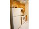 Bright kitchen with classic white appliances and ample cabinet space at 408 Gloucester Blvd # 33, Sun City Center, FL 33573
