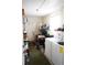 Laundry room with washer, dryer and storage shelves at 408 Gloucester Blvd # 33, Sun City Center, FL 33573