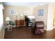 Comfortable living room with hardwood floors and a large TV for relaxing entertainment at 408 Gloucester Blvd # 33, Sun City Center, FL 33573