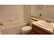 Bathroom view featuring a shower-tub combo and a sink, highlighting the bathroom fixtures at 4133 Bismarck Palm Dr, Tampa, FL 33610
