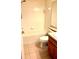 Bathroom with tiled walls, standard toilet, and vanity with sink at 4133 Bismarck Palm Dr, Tampa, FL 33610
