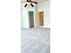 Bedroom with carpet, ceiling fan, closet, and ensuite at 4133 Bismarck Palm Dr, Tampa, FL 33610