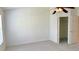 Bedroom with large window, carpet, ceiling fan, and closet at 4133 Bismarck Palm Dr, Tampa, FL 33610