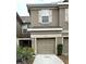 Charming townhouse exterior with well-maintained landscaping at 4133 Bismarck Palm Dr, Tampa, FL 33610