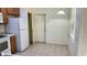 An expansive kitchen features overhead lighting and white appliances at 4133 Bismarck Palm Dr, Tampa, FL 33610