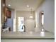 An expansive kitchen features overhead lighting, a counter top and white appliances at 4133 Bismarck Palm Dr, Tampa, FL 33610