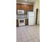 Functional kitchen featuring white appliances and ample cabinet space at 4133 Bismarck Palm Dr, Tampa, FL 33610