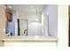 An expansive kitchen features overhead lighting, a counter top and white appliances at 4133 Bismarck Palm Dr, Tampa, FL 33610