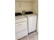 Laundry room featuring side-by-side washer and dryer and wire shelving at 4133 Bismarck Palm Dr, Tampa, FL 33610