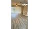 Inviting living room featuring wood-look floors and sliding glass doors to the outside at 4133 Bismarck Palm Dr, Tampa, FL 33610