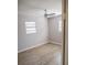 Small bedroom with laminate floors, a modern ceiling fan and two windows at 4402 Ohio Ave, Tampa, FL 33616