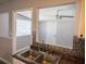 Galley-style kitchen featuring stainless steel sink, decorative tile backsplash, and an open view to the adjacent room at 4402 Ohio Ave, Tampa, FL 33616