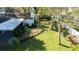 Aerial view of backyard with a lush lawn, landscaping, and room for outdoor enjoyment at 4915 Churchill Pl, Land O Lakes, FL 34639