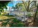 Backyard with a cozy outdoor seating area and landscaping, perfect for relaxing or entertaining at 4915 Churchill Pl, Land O Lakes, FL 34639