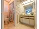 Charming bathroom with shower and vanity, featuring floral wallpaper and tiled floors at 4915 Churchill Pl, Land O Lakes, FL 34639