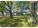 Charming home with a well-kept lawn and mature trees, providing a serene and inviting curb appeal at 4915 Churchill Pl, Land O Lakes, FL 34639