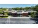 Exterior shot of the modern community library with a clean façade, inviting entrance, and ample parking at 4915 Churchill Pl, Land O Lakes, FL 34639