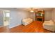 Spacious living room features wood-look flooring and a brick fireplace at 4915 Churchill Pl, Land O Lakes, FL 34639