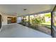 Relaxing screened patio with views of the lush backyard at 4915 Churchill Pl, Land O Lakes, FL 34639
