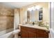 Well-appointed bathroom featuring a granite vanity, tiled shower, and modern fixtures at 50 Harbor View Ln # 21, Belleair Bluffs, FL 33770