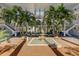 Inviting courtyard with a fountain, palms, and white staircases, perfect for relaxation and enjoyment at 50 Harbor View Ln # 21, Belleair Bluffs, FL 33770