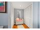 Hallway with ample closet space and a seating area, enhancing the home's functionality and comfort at 50 Harbor View Ln # 21, Belleair Bluffs, FL 33770