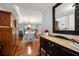 Inviting interior featuring hardwood floors, a dining area, and a glimpse of a modern kitchen at 50 Harbor View Ln # 21, Belleair Bluffs, FL 33770