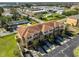 An aerial view of the property highlighting the townhomes and neighborhood at 5036 Sand Castle Dr, New Port Richey, FL 34652