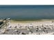 High angle shot of the beautiful beach featuring a pier, gazebos and parking at 5036 Sand Castle Dr, New Port Richey, FL 34652
