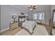 Well-lit bedroom featuring neutral tones, hardwood floors, and elegant furnishings at 5036 Sand Castle Dr, New Port Richey, FL 34652